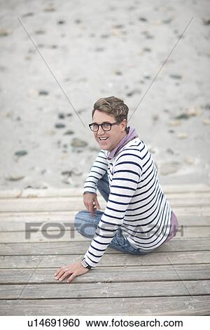 Man on beach turning around towards camera View Large Photo Image Stock Image - Man on beach turning around towards camera. Fotosearch