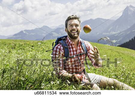 Man throwing apple, Tyrol, Austria View Large Photo Image Picture - Man throwing apple, Tyrol, Austria. Fotosearch
