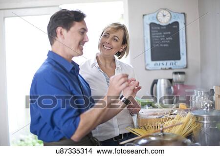 Mature couple in kitchen View Large Photo Image Picture - Mature couple in kitchen. Fotosearch