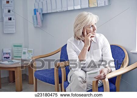 Stock Photography - Mature female patient in hospital waiting room. Fotosearch