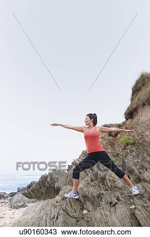 Mature woman exercising on rocks View Large Photo Image Stock Image - Mature woman exercising on rocks. Fotosearch