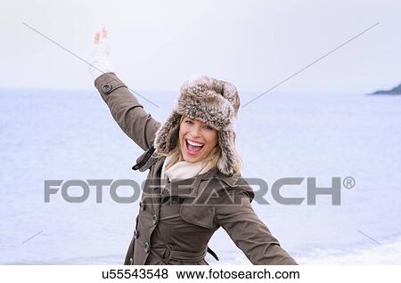 Mid adult woman having fun on beach, Thurlestone, Devon, UK View Large Photo Image Stock Photo - Mid adult woman having fun on beach, Thurlestone, Devon, UK. Fotosearch