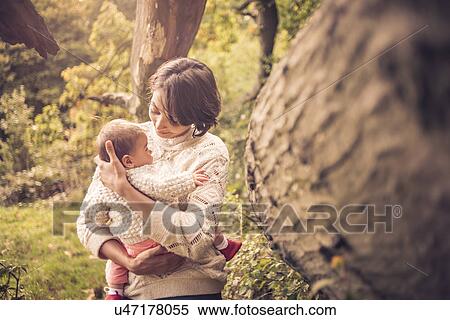 Mother and baby enjoying park View Large Photo Image Stock Photography - Mother and baby enjoying park. Fotosearch