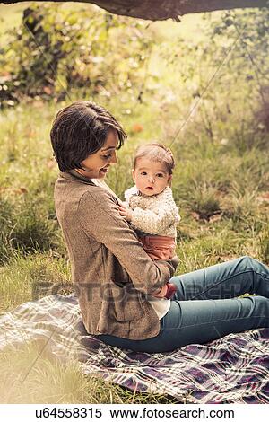 Mother and baby enjoying park View Large Photo Image Stock Photography - Mother and baby enjoying park. Fotosearch
