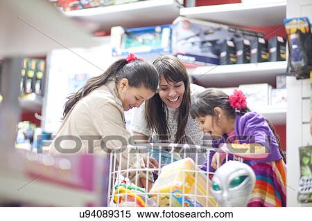 Mother and two daughters choosing toys View Large Photo Image Stock Photography - Mother and two daughters choosing toys. Fotosearch