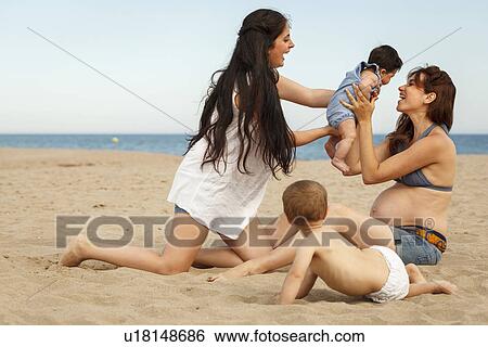 Mothers and babies on beach View Large Photo Image Stock Photograph - Mothers and babies on beach. Fotosearch