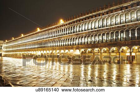 Stock Image - Night time view of St Marks square, Venice, Italy. Fotosearch
