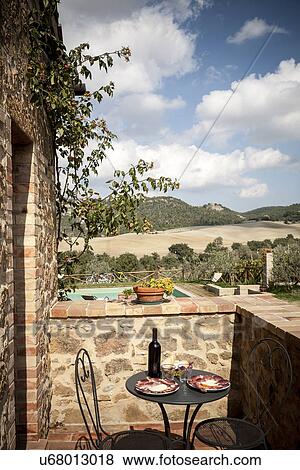 Outdoor table and chairs, Siena, Valle Orcia, Tuscany, Italy View Large Photo Image Stock Photo - Outdoor table and chairs, Siena, Valle Orcia, Tuscany, Italy. Fotosearch