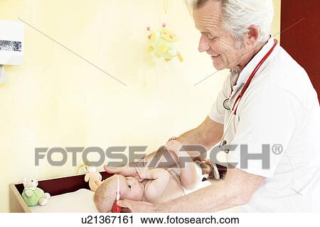 Paediatrician examining baby girl, measuring head View Large Photo Image Stock Image - Paediatrician examining baby girl, measuring head. Fotosearch