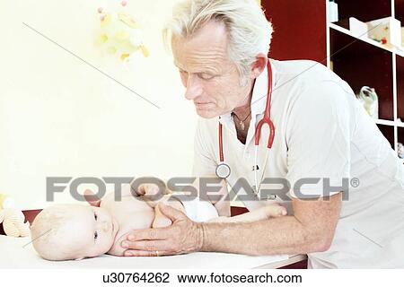 Paediatrician examining baby girl View Large Photo Image Stock Image - Paediatrician examining baby girl. Fotosearch