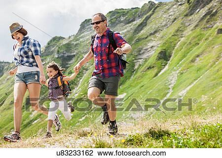 Parents with daughter hiking, Tyrol, Austria View Large Photo Image Stock Image - Parents with daughter hiking, Tyrol, Austria. Fotosearch