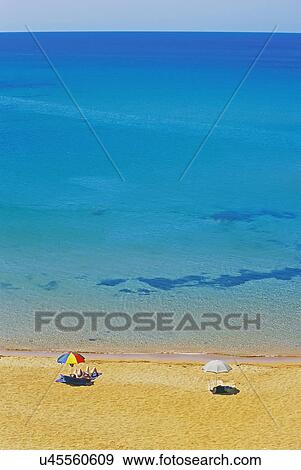 People relaxing on Menorca beach, Balearic Islands, Spain View Large Photo Image Stock Photo - People relaxing on Menorca beach, Balearic Islands, Spain. Fotosearch