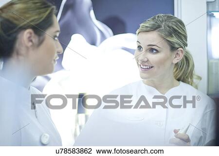 Pharmacists having conversation View Large Photo Image Stock Image - Pharmacists having conversation. Fotosearch