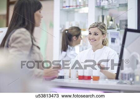 Pharmacists talking to customer View Large Photo Image Stock Image - Pharmacists talking to customer. Fotosearch