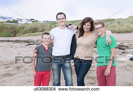 Picture - Portrait of family on beach. Fotosearch