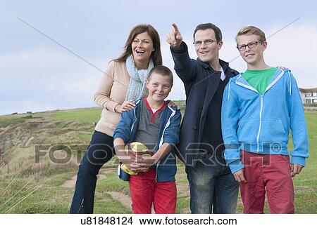 Portrait of family on sand dunes View Large Photo Image Picture - Portrait of family on sand dunes. Fotosearch