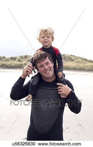 Portrait of father carrying son on shoulders View Large Photo Image Stock Image - Portrait of father carrying son on shoulders. Fotosearch