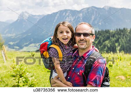 Portrait of father with daughter, Tyrol, Austria View Large Photo Image Stock Photograph - Portrait of father with daughter, Tyrol, Austria. Fotosearch
