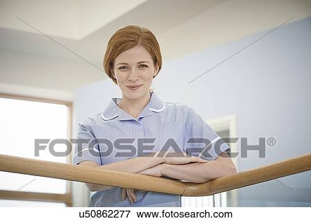 Portrait of female nurse in hospital corridor View Large Photo Image Stock Photo - Portrait of female nurse in hospital corridor. Fotosearch