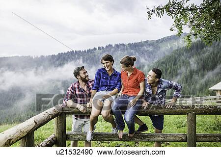 Stock Image - Portrait of four friends, Tyrol Austria. Fotosearch