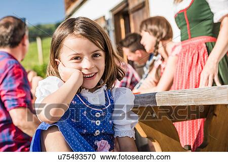 Portrait of girl at breakfast outside chalet, Tyrol, Austria View Large Photo Image Stock Image - Portrait of girl at breakfast outside chalet, Tyrol, Austria. Fotosearch