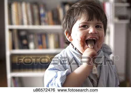 Portrait of male toddler licking chocolate covered teaspoon View Large Photo Image Stock Photograph - Portrait of male toddler licking chocolate covered teaspoon. Fotosearch