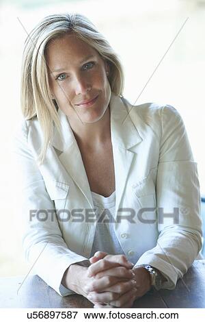 Portrait of mature woman wearing white jacket View Large Photo Image Stock Photo - Portrait of mature woman wearing white jacket. Fotosearch