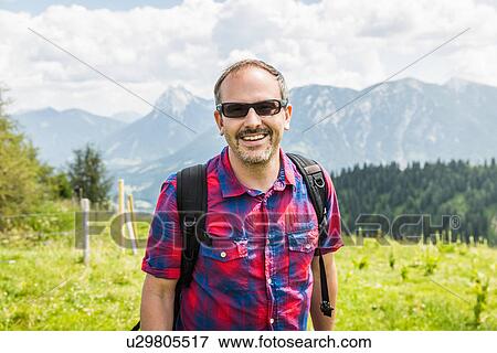 Stock Photo - Portrait of mid adult man, Tyrol, Austria. Fotosearch