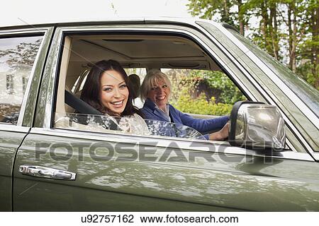 Portrait of mother and daughter in car View Large Photo Image Stock Image - Portrait of mother and daughter in car. Fotosearch