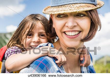 Portrait of mother and daughter smiling View Large Photo Image Stock Photograph - Portrait of mother and daughter smiling. Fotosearch