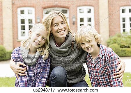 Portrait of mother with two children View Large Photo Image Stock Photo - Portrait of mother with two children. Fotosearch