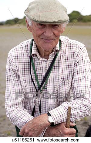Portrait of senior man wearing flat cap View Large Photo Image Stock Image - Portrait of senior man wearing flat cap. Fotosearch