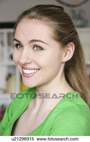 Stock Photography - Portrait of teenage girl, smiling. Fotosearch
