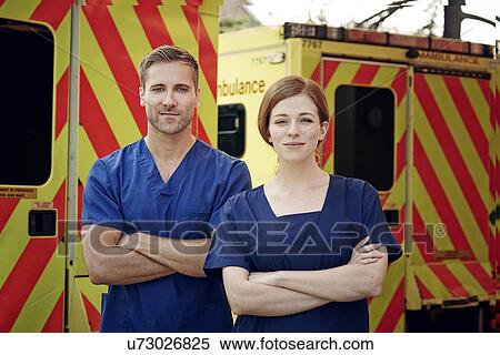 Portrait of two emergency medical technicians next to ambulance View Large Photo Image Stock Photography - Portrait of two emergency medical technicians next to ambulance. Fotosearch