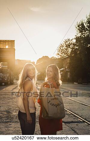 Portrait of two female friends, Berlin, Germany View Large Photo Image Stock Photo - Portrait of two female friends, Berlin, Germany. Fotosearch