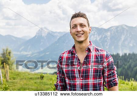Stock Image - Portrait of young man, Tyrol, Austria. Fotosearch
