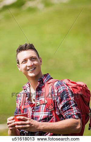 Portrait of young man with backpack View Large Photo Image Stock Image - Portrait of young man with backpack. Fotosearch