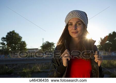 Portrait of young woman in leather jacket and beanie View Large Photo Image Stock Photography - Portrait of young woman in leather jacket and beanie. Fotosearch