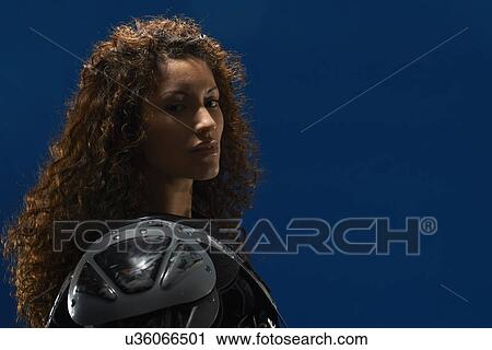 Portrait of young woman wearing american football shoulder pads View Large Photo Image Stock Image - Portrait of young woman wearing american football shoulder pads. Fotosearch