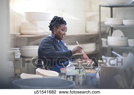 Potter preparing paint at crockery factory View Large Photo Image Stock Image - Potter preparing paint at crockery factory. Fotosearch