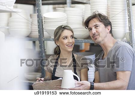 Potters chatting at crockery factory View Large Photo Image Stock Image - Potters chatting at crockery factory. Fotosearch