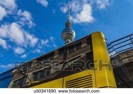 Public bus and TV Tower, Berlin, Germany View Large Photo Image Stock Image - Public bus and TV Tower, Berlin, Germany. Fotosearch