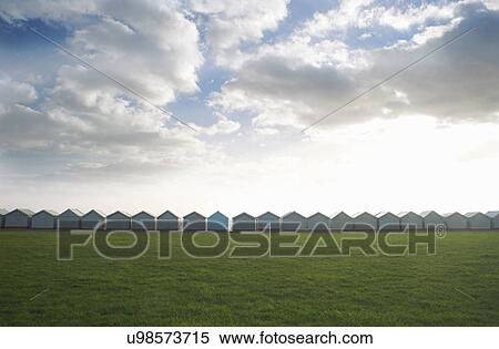 Row of coastal beach huts, Sussex, United Kingdom View Large Photo Image Stock Photography - Row of coastal beach huts, Sussex, United Kingdom. Fotosearch