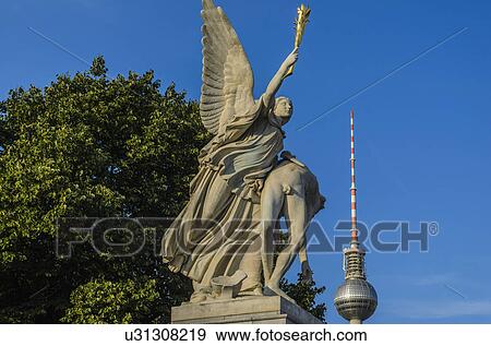 Sculpture of Nike taking the fallen hero to Olympus on Palace Bridge (Schlossbrucke), Berlin, Germany View Large Photo Image Stock Photo - Sculpture of Nike taking the fallen hero to Olympus on Palace Bridge (Schlossbrucke), Berlin, Germany. Fotosearch