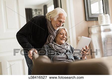 Stock Photo - Senior couple with digital tablet. Fotosearch