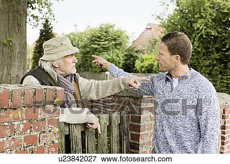 Senior man and mid adult man arguing View Large Photo Image Stock Photo - Senior man and mid adult man arguing. Fotosearch