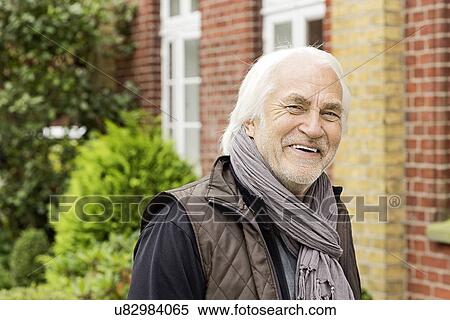 Stock Photography - Senior man smiling towards camera. Fotosearch