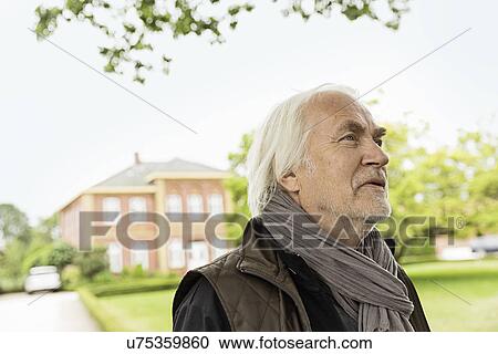 Senior man wearing scarf looking away View Large Photo Image Stock Image - Senior man wearing scarf looking away. Fotosearch