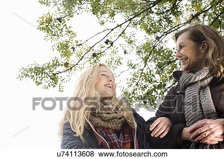 Stock Photo - Senior woman and granddaughter enjoying outdoors. Fotosearch