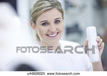 Shop assistant showing make up View Large Photo Image Stock Photography - Shop assistant showing make up. Fotosearch